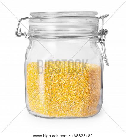 Corn grits in glass kitchen container isolated on white background with clipping path. Transparent jar with maize grits