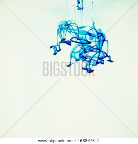 Soluble in water a drop of blue dye.