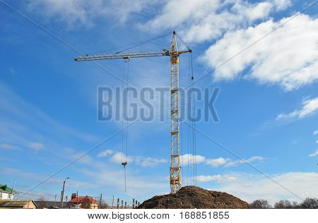 Crane Building New House on the Construction Site. House building good for economic growth. If we want economic growth we must build more houses.