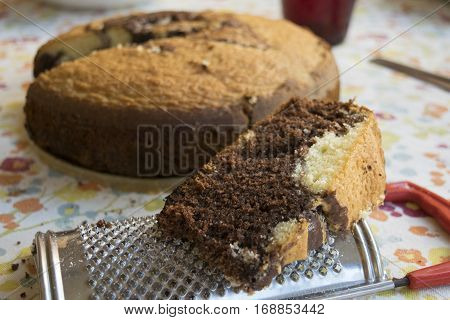 slice of homemade chocolate sponge cake or ciambellone