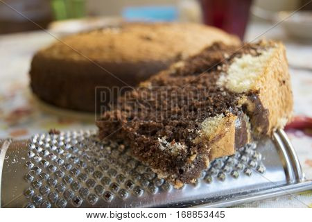 slice of homemade chocolate and vanilla  sponge cake