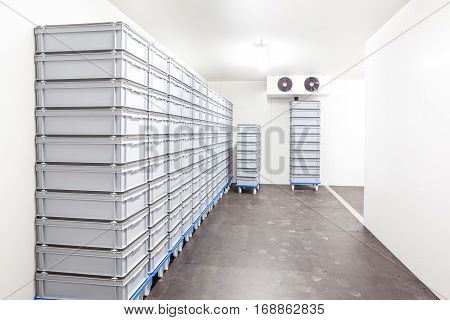 an industrial room refrigerator with two fans