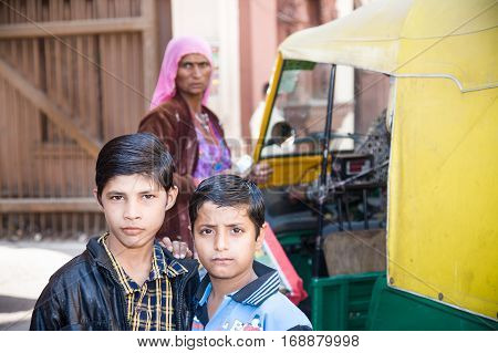 Jodhpur India - 2015 January 4 : Two young Indian kids posing outside for the camera with a selfconfident look in Jodhpur