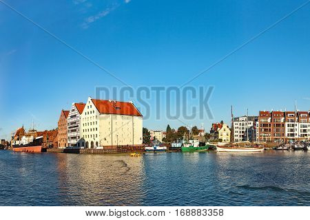 View across the Motlawa River to the Granary Island in Gdansk Poland.