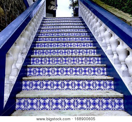 Old balustrade staircase with Portuguese  tiles and marble