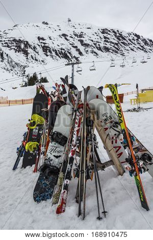 HINTERTUX, AUSTRIA - MARCH 29, 2015: Skier and snowboards standing on a wooden frame close to the Grillhofalm at Horberg mountain in Tyrol Austria
