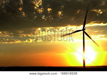 Power generated by wind with winmill blowing sky clouds sunset sunrise