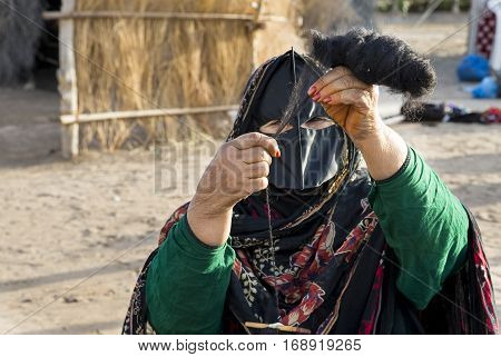 Muscat Oman February 4th 2017: omanya making yarn out of wool