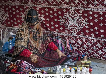 Muscat Oman February 4th 2017: Old lady in traditional clothing