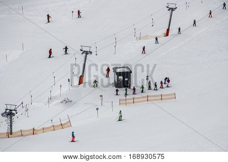Ski lift at the Rastkogel mountain in Tyrol Austria with people skiing