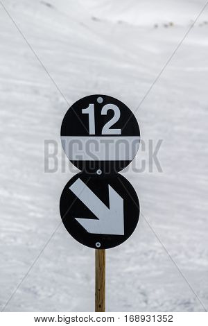 Signpost of a black piste at the Horberg mountain (route 12) in the ski region of the Hintertuxer Glacier (Tuxer Ferner) in Tyrol Austria
