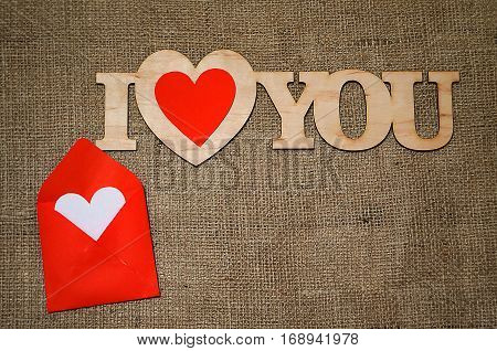 Hearts flowers ribbons on a wooden light background
