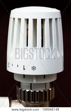 Thermostatic radiator valve set to minimal temperature for saving