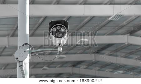 CCTV surveillance security camera video equipment in tower home and house building on wall for safety system area control outdoor with copyspace