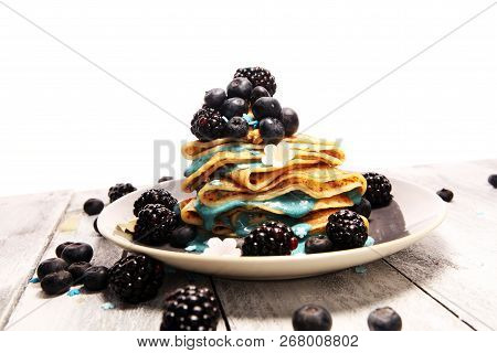 Delicious Tasty Homemade Crepes Or Pancakes With Blackberries,blueberries And Blue Spirulina Nicecre