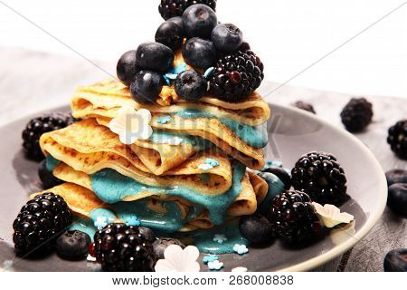 Delicious Tasty Homemade Crepes Or Pancakes With Blackberries,blueberries And Blue Spirulina Nicecre