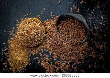 Close Up Of Ayurvedic Herb Alsi Or Adsi Or Flax Seed In A Black Colored Clay Bowl With Its Powder On
