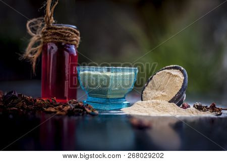 Close Up Of Popular Way Of Ex Foliating On Wooden Surface I.e. Multani  Mitti Or Fuller's Earth Well