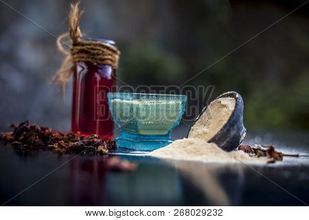 Close Up Of Popular Way Of Ex Foliating On Wooden Surface I.e. Multani  Mitti Or Fuller's Earth Well
