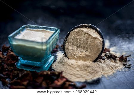 Close Up Of Popular Way Of Ex Foliating On Wooden Surface I.e. Multani  Mitti Or Fuller's Earth Well