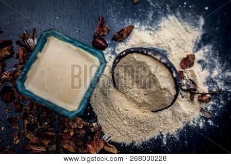 Close Up Of Popular Way Of Ex Foliating On Wooden Surface I.e. Multani  Mitti Or Fuller's Earth Well
