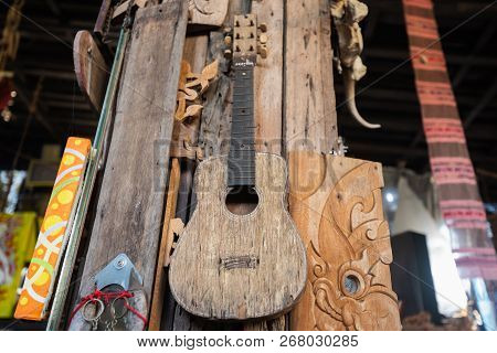 Close Up Of Old Wood Guiter On The Wall