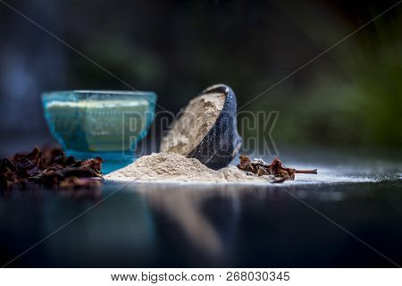 Close Up Of Popular Way Of Ex Foliating On Wooden Surface I.e. Multani  Mitti Or Fuller's Earth Well