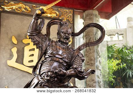 Sculpture Chinese Deity God Guardian At Entrance Of Wong Tai Sin Temple For People Visit And Respect