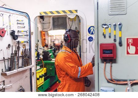 Marine Engineer Officer Working In Engine Room