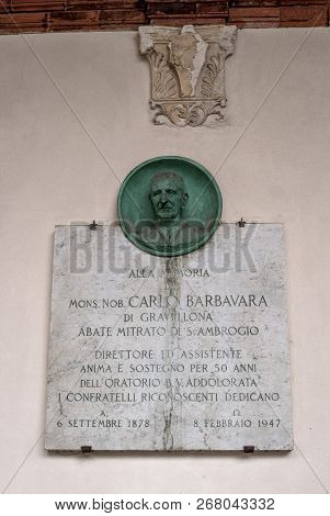 Milan, Italy-09 May 2018: Memorial Plaque On The Wall Of The Basilica Of Santambrogio. In The Church