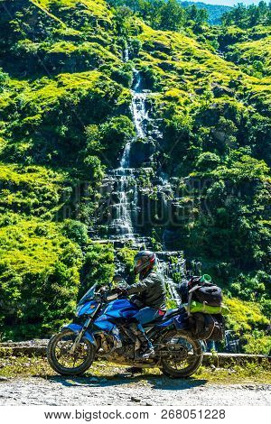 Rider At Waterfall In Darma Valley In Himalayas - Uttarakhand