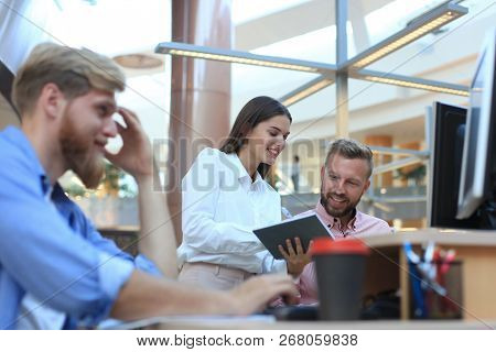 Group Of Young Modern People In Smart Casual Wear Having A Brainstorm Meeting While Standing In The 