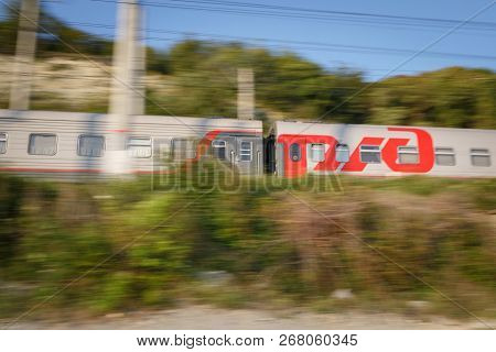 Russia, Krasnodar Krai, Gizele-dere Village,  August 06, 2018: The Moving Passenger Train Of The Rus