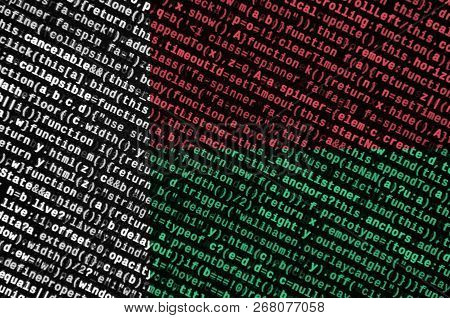 Madagascar Flag  Is Depicted On The Screen With The Program Code. The Concept Of Modern Technology A