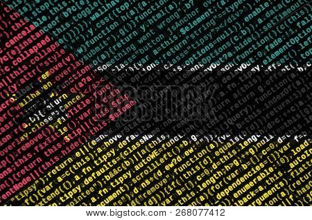 Mozambique Flag  Is Depicted On The Screen With The Program Code. The Concept Of Modern Technology A