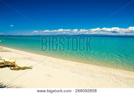 Sandy Beach With Blue Paradise Water Of Toroneos Kolpos Gulf, Blue Sky, White Clouds Over Sithonia P