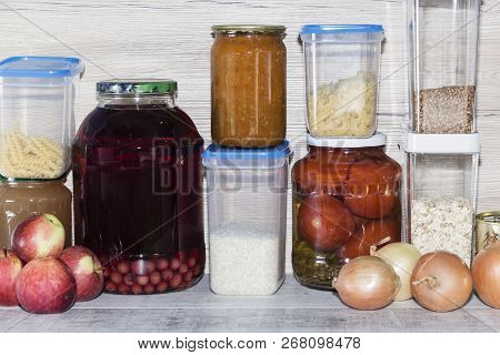 Storage Shelves In Pantry With Homemade Canned Preserved Fruits And Vegetables