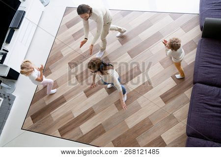 Happy Family Playing Hide And Seek At Home