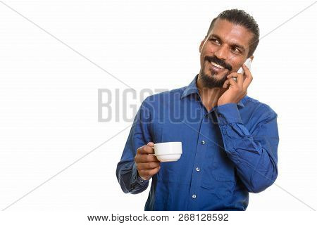 Young Happy Indian Businessman Talking On Mobile Phone And Holdi
