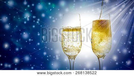 Two Glass Of Champagne Wine Close-up With Bubbles And Fizz, On Beautiful Christmas And New Year`s Ba