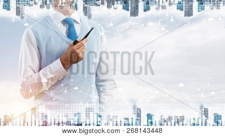 Double Exposure Of Confident And Young Businessman In Smart-casual Wear Smoking Pipe And Modern City