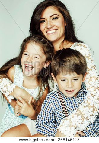 Young Mother With Two Children On White Background, Happy Smilin