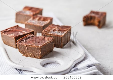 Raw Vegan Chocolate Cake Slices On White Background. Plant Based Diet Dessert.