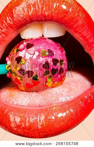 Lollipop With Hearts In The Mouth. Sweet Kiss On Valentine's Day. Caries For White Teeth. Sweets For