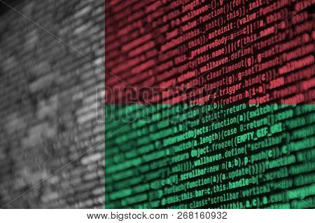 Madagascar Flag  Is Depicted On The Screen With The Program Code. The Concept Of Modern Technology A
