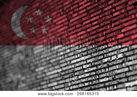 Singapore Flag  Is Depicted On The Screen With The Program Code. The Concept Of Modern Technology An