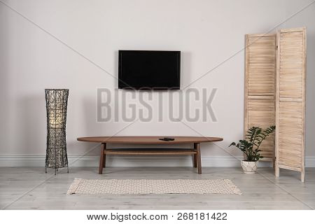 Modern Tv Set Mounted On Wall In Living Room