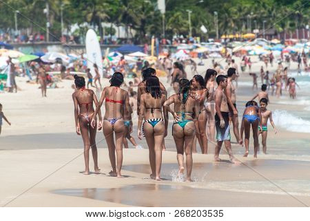 Rio De Janeiro, Brazil - January 27, 2015: Girls In Bikinis Enjoy The Famous Beach Ipanema In Rio De