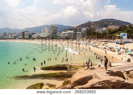 Rio De Janeiro, Brazil - January 27, 2015: People Enjoy The Famous Beach Ipanema In Rio De Janeiro.