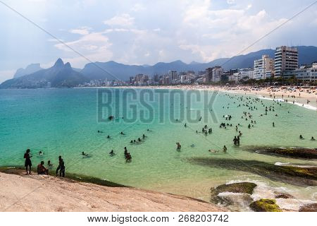 Rio De Janeiro, Brazil - January 27, 2015: People Enjoy The Famous Beach Ipanema In Rio De Janeiro.